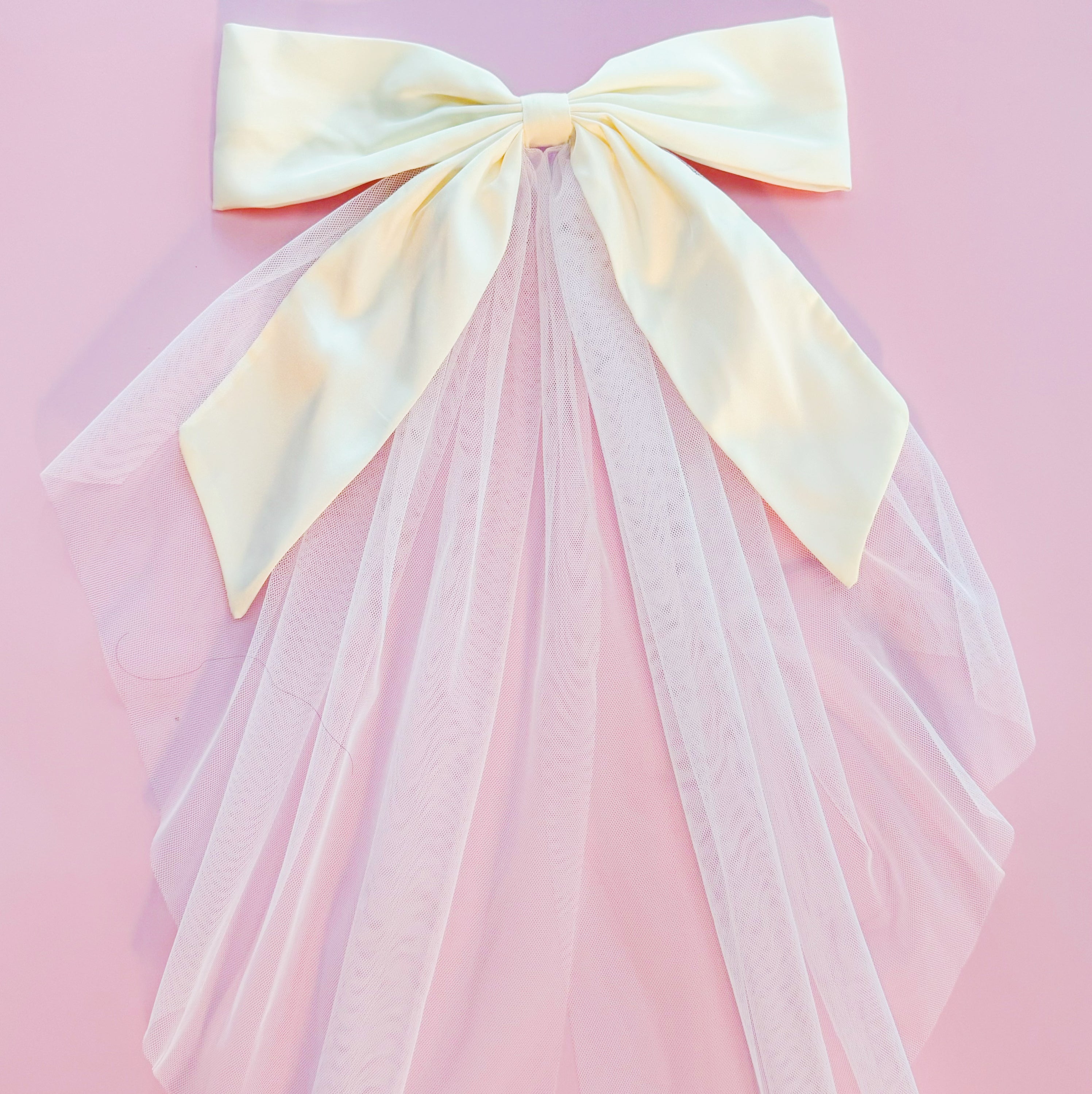 OMG Beauty Veil Bow Hair Clip featuring a satin bow and tulle veil, perfect for elegant hairstyles.