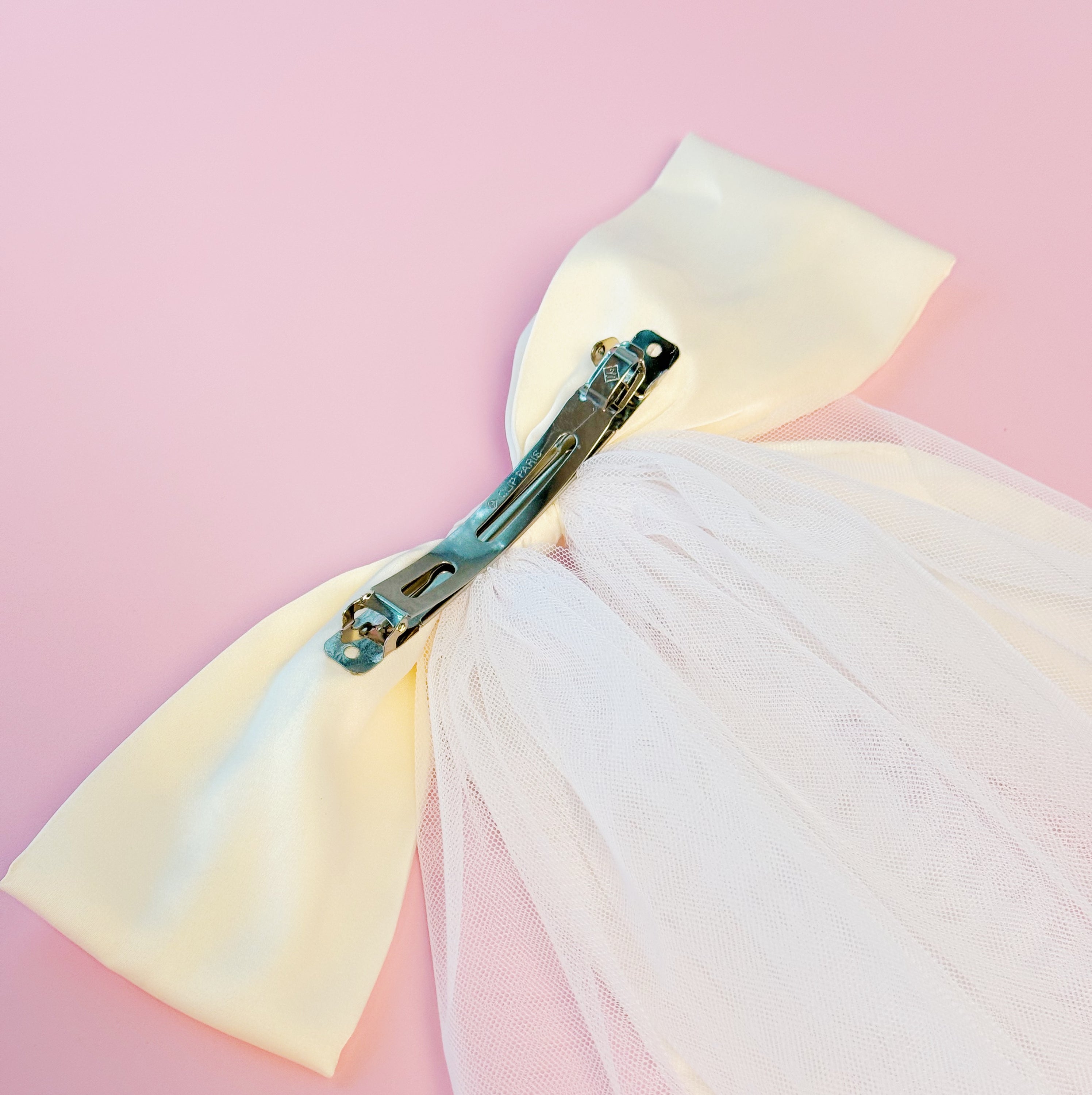 OMG Beauty Veil Bow Hair Clip featuring a satin bow and tulle veil, perfect for elegant hairstyles.