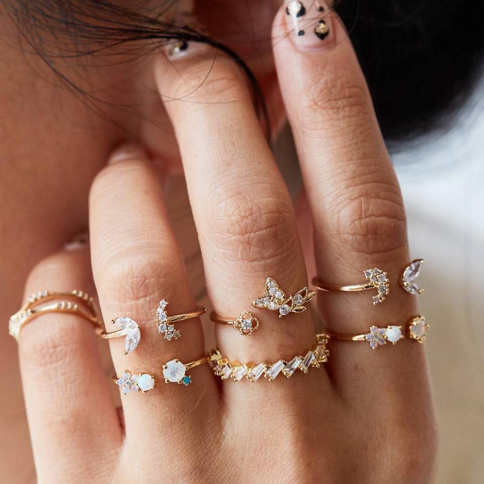 A beautiful 6-piece ring set featuring opal and butterfly crystals, crafted from 14K gold plated brass.