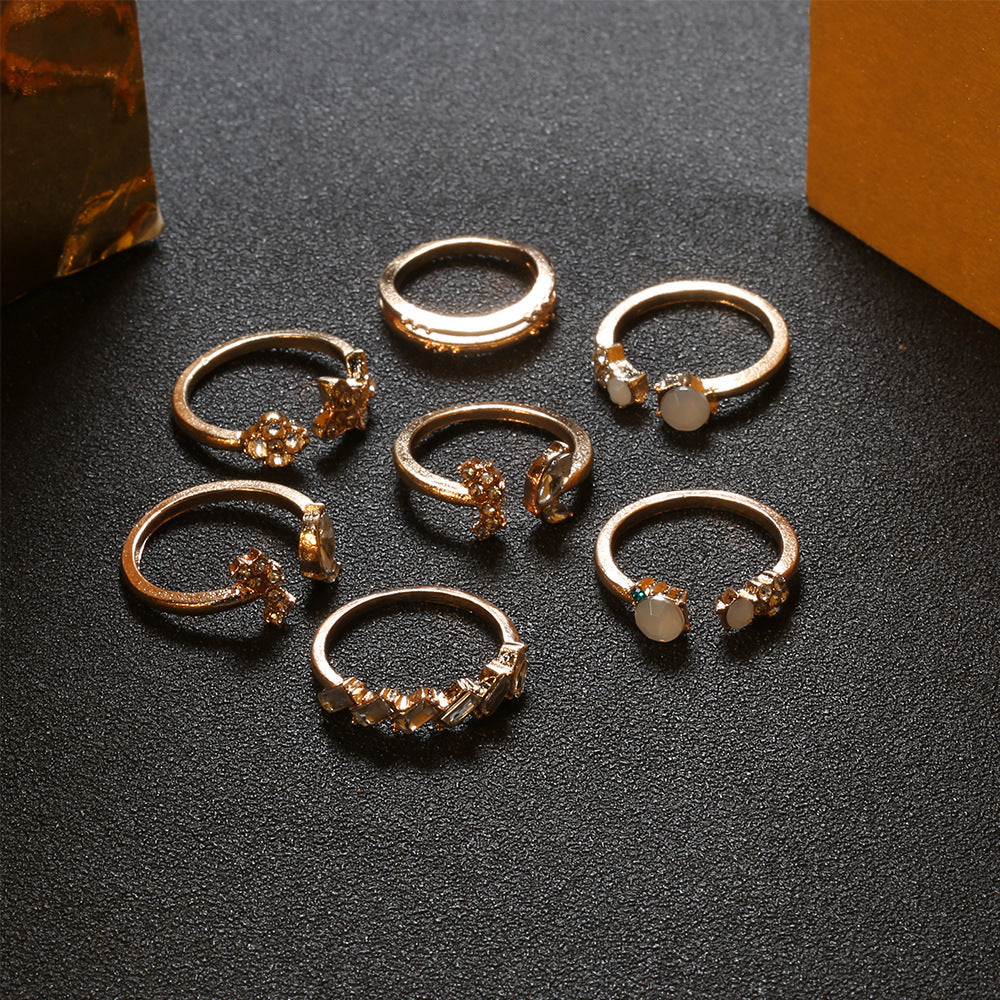 A beautiful 6-piece ring set featuring opal and butterfly crystals, crafted from 14K gold plated brass.