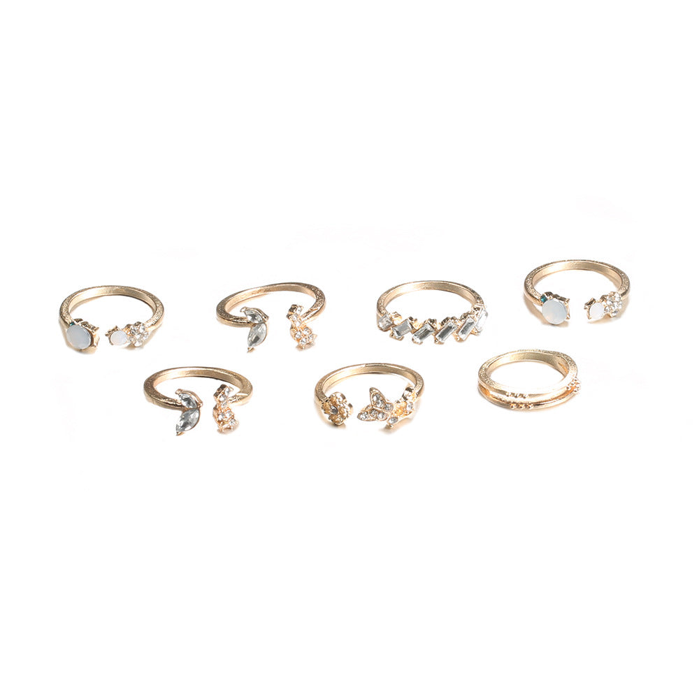 A beautiful 6-piece ring set featuring opal and butterfly crystals, crafted from 14K gold plated brass.