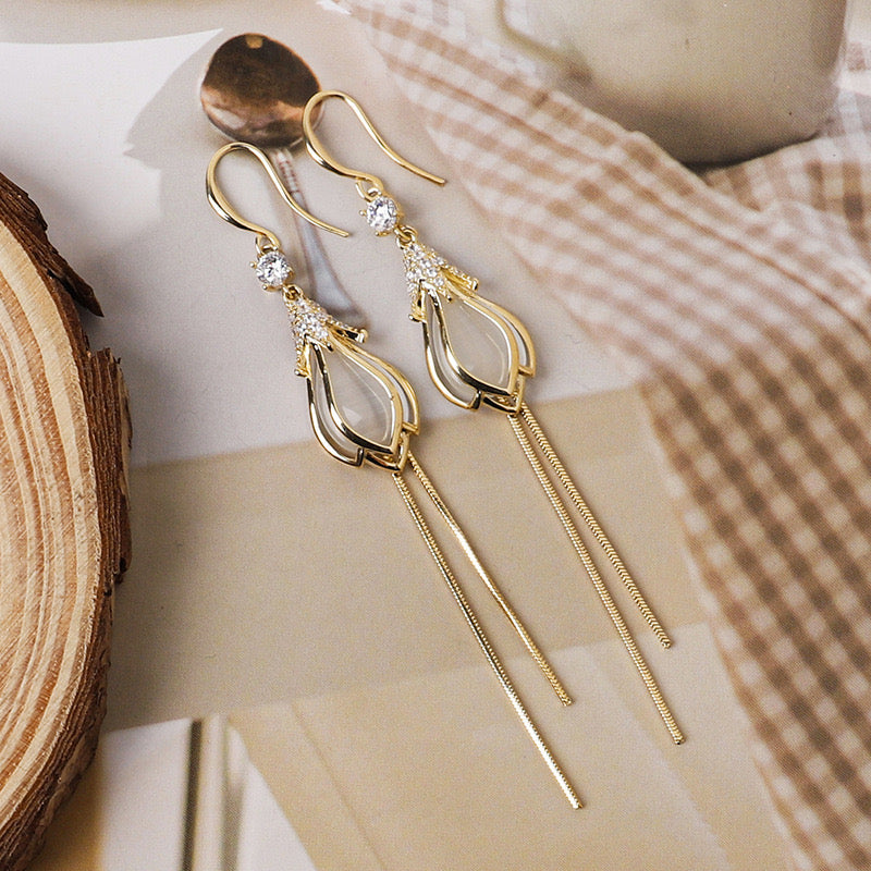 Elegant Opal Flower Bud Earrings with Tassels, featuring rhinestones and a delicate design.