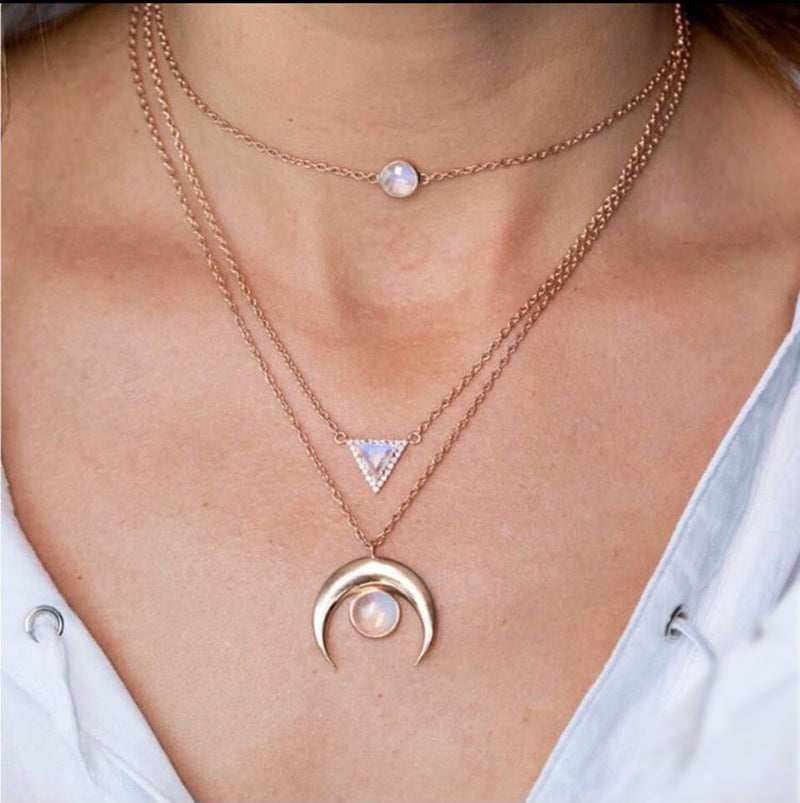 Opal Thai Inspired Crescent Necklace featuring a crescent pendant with a white opal stone, elegantly designed with 14K gold plating.