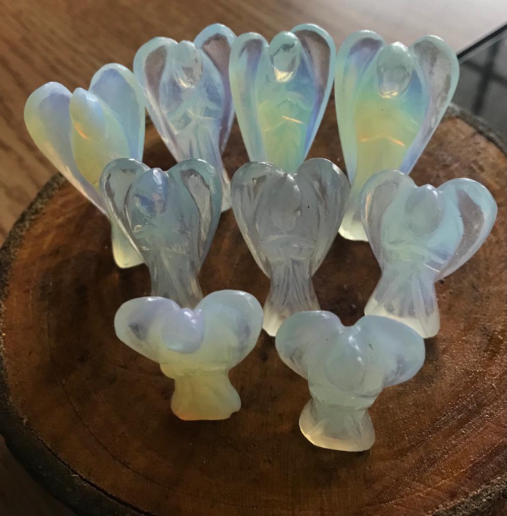 A 2-inch Opalite Crystal Angel figurine, showcasing its milky opalescent colors and delicate angelic features, perfect for emotional healing and decoration.