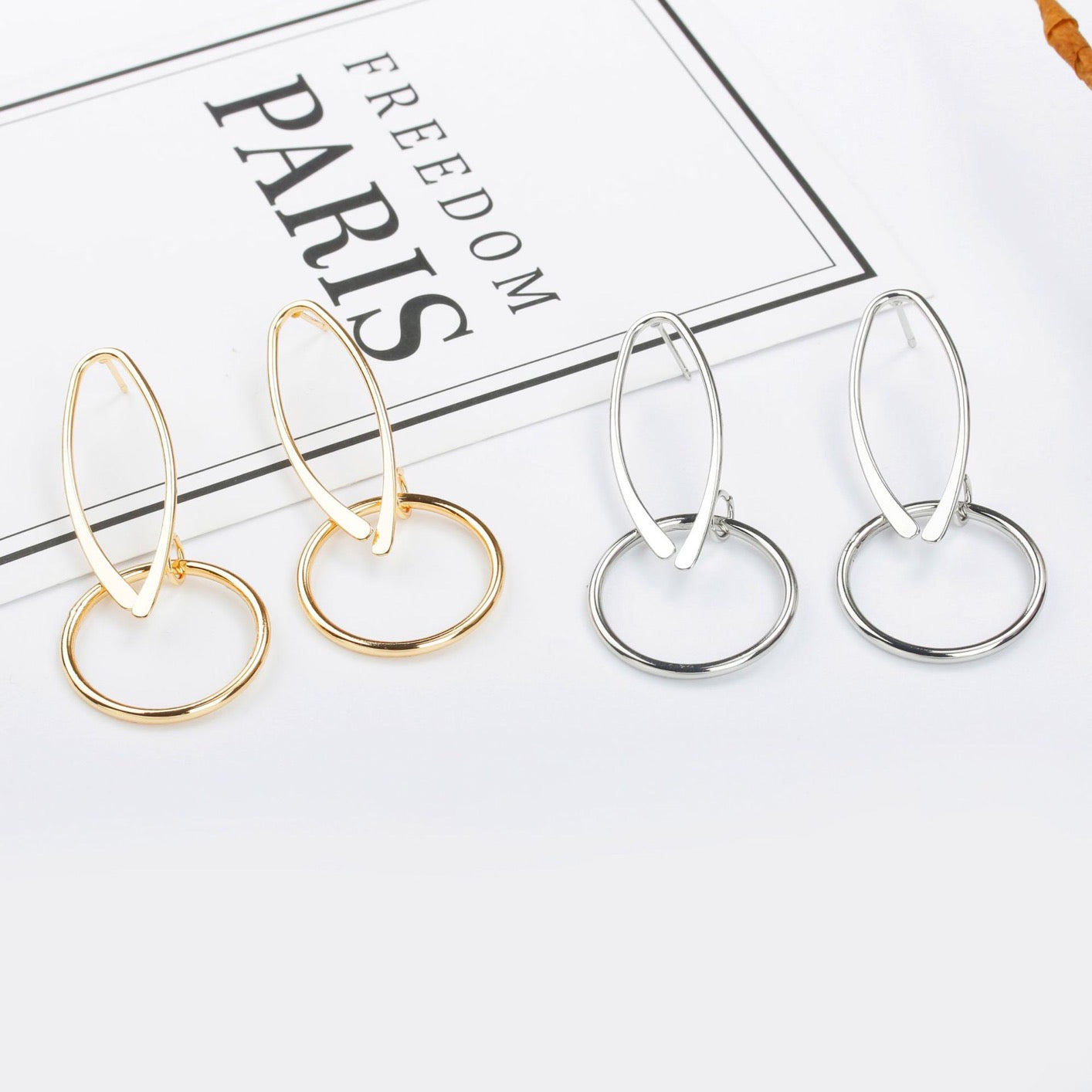 A pair of elegant Opening Oval Linked Round Hoop Earrings made from alloy, showcasing a unique linked design and lightweight structure.