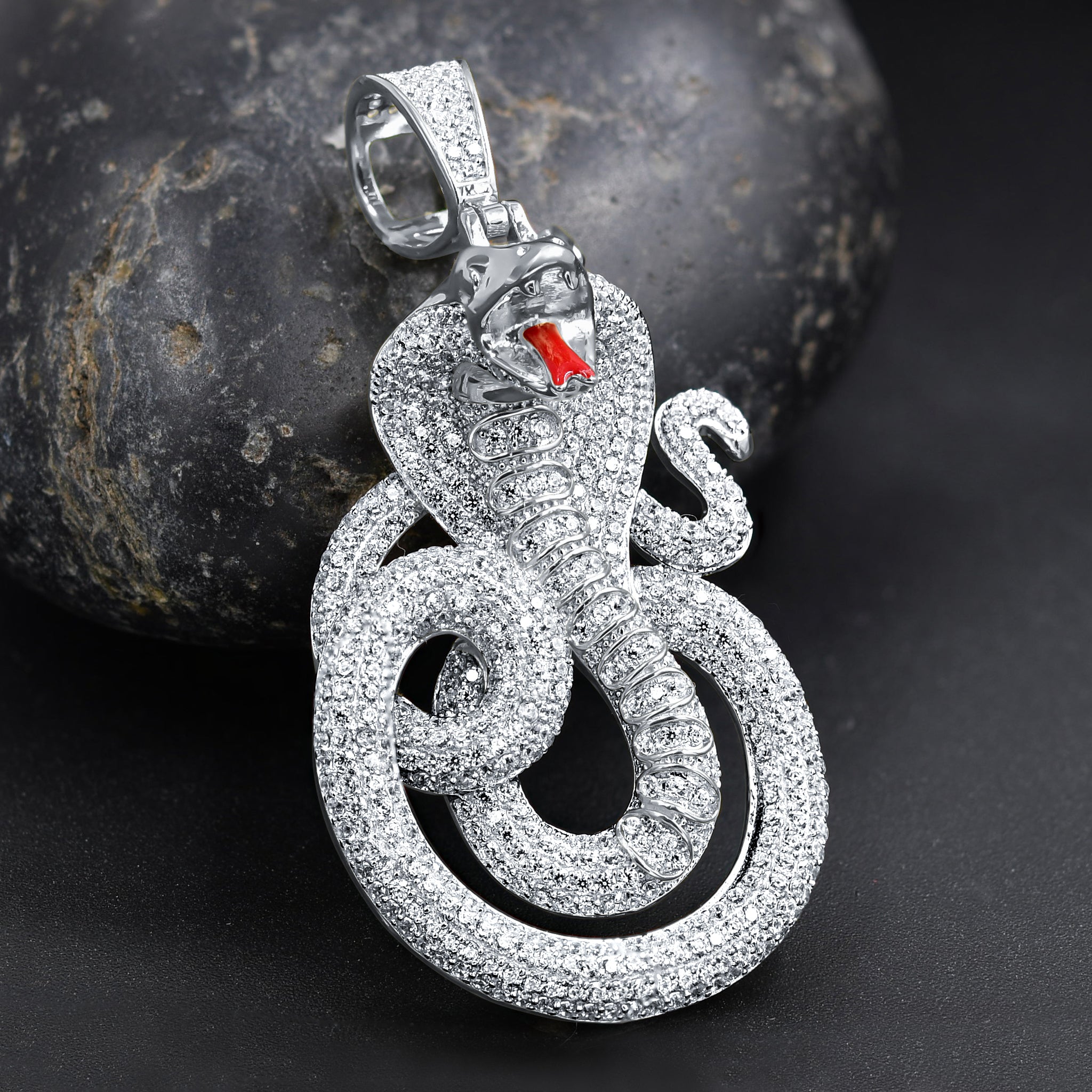 OPHIDIAN Sterling Silver Pendant featuring a snake design with cubic zircon stones, showcasing its elegant shine and craftsmanship.