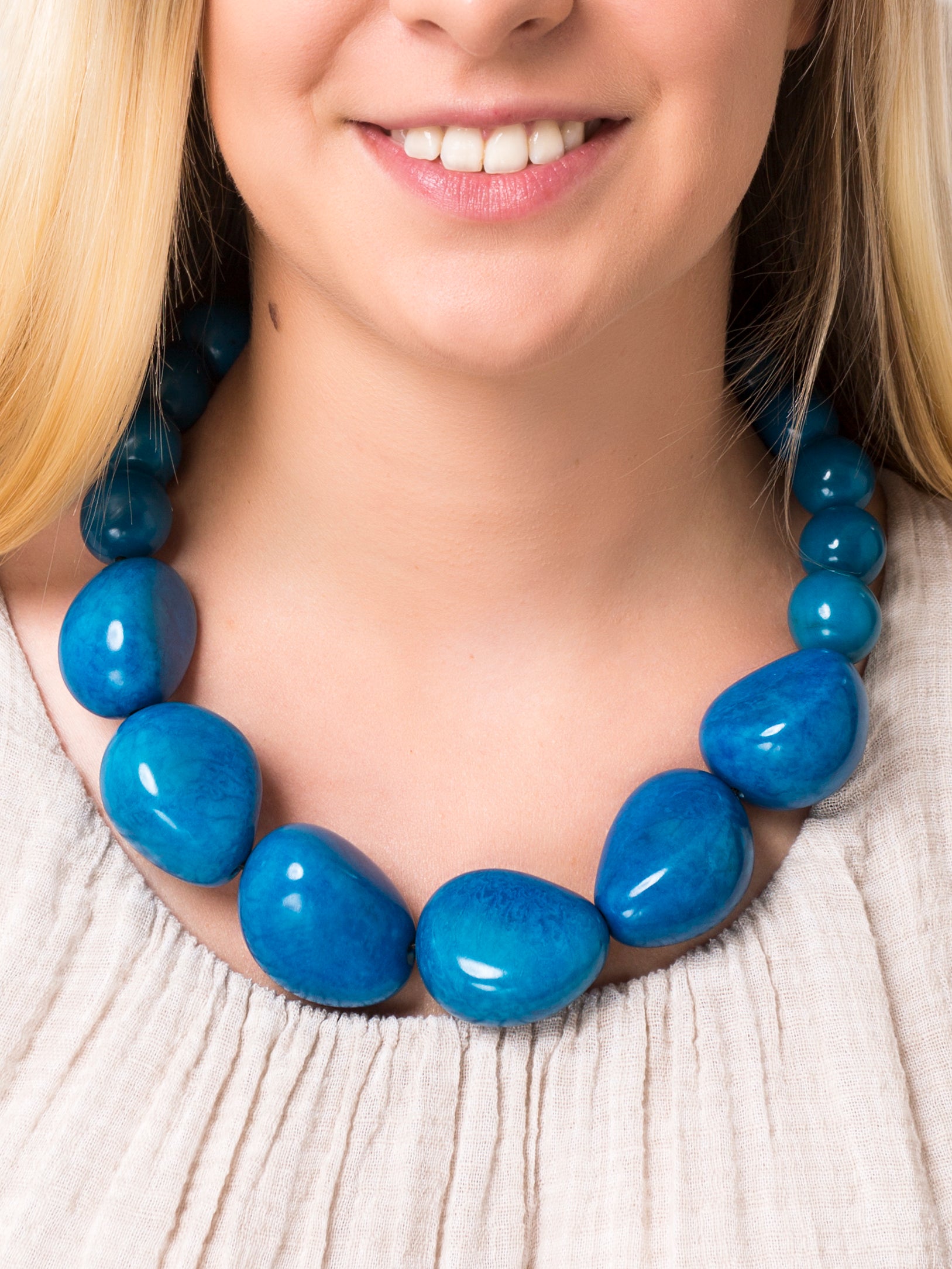 Organico Tagua Necklace featuring vibrant colors and handmade macrame clasp, showcasing its unique organic design.