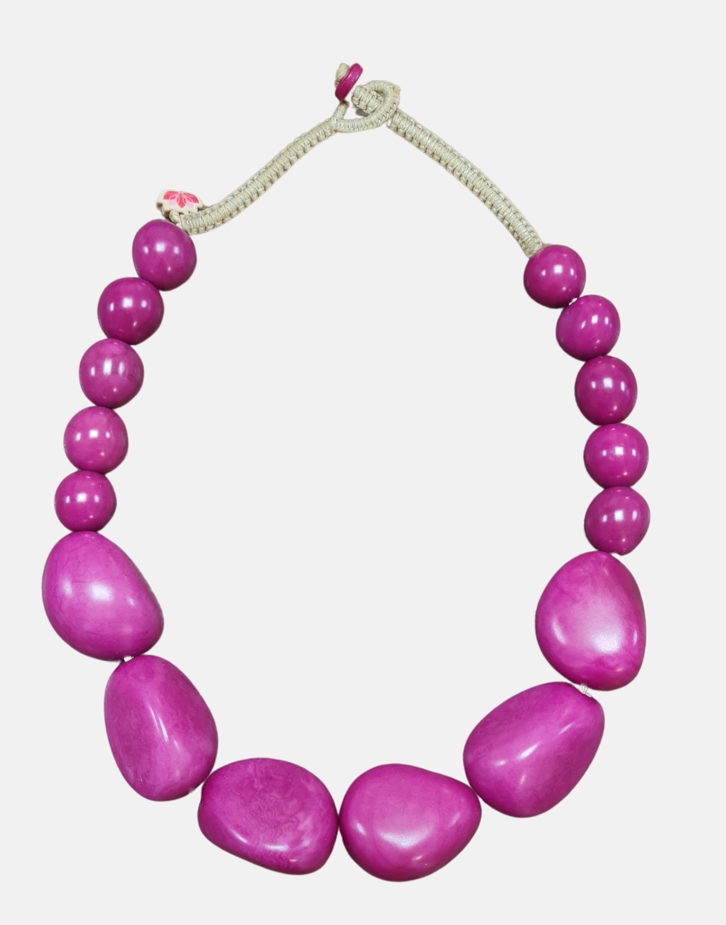 Organico Tagua Necklace featuring vibrant colors and handmade macrame clasp, showcasing its unique organic design.