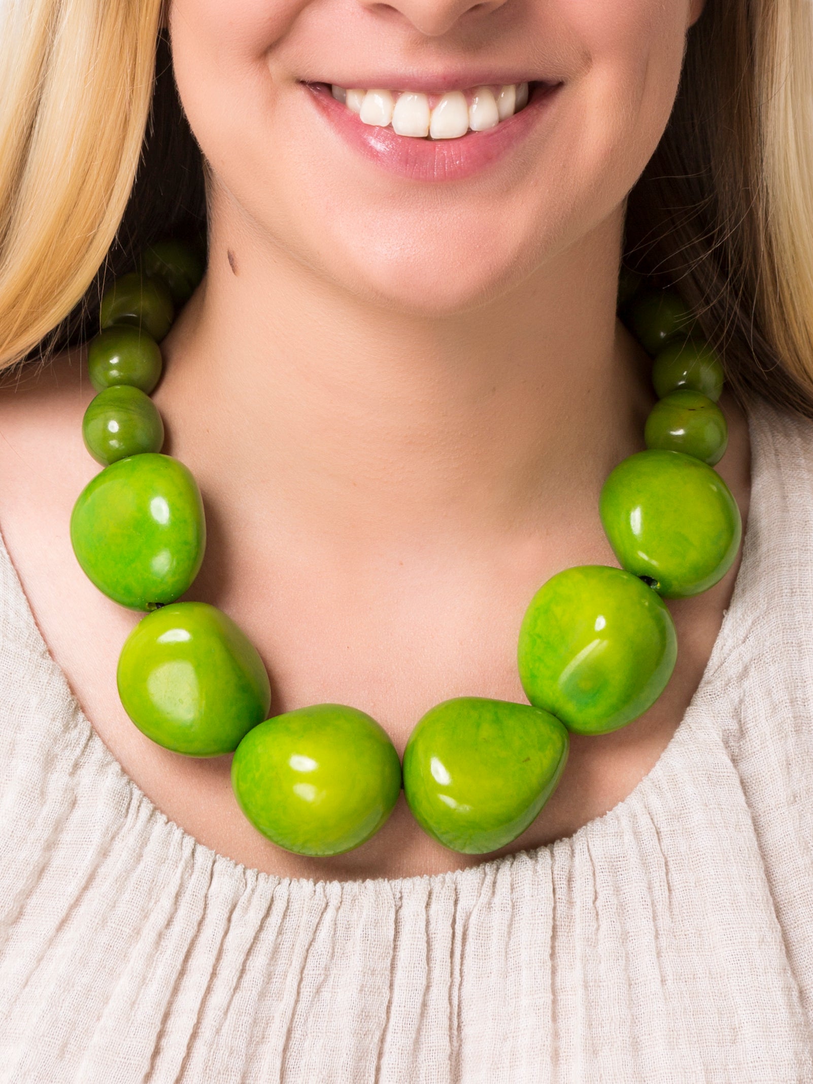 Organico Tagua Necklace featuring vibrant colors and handmade macrame clasp, showcasing its unique organic design.