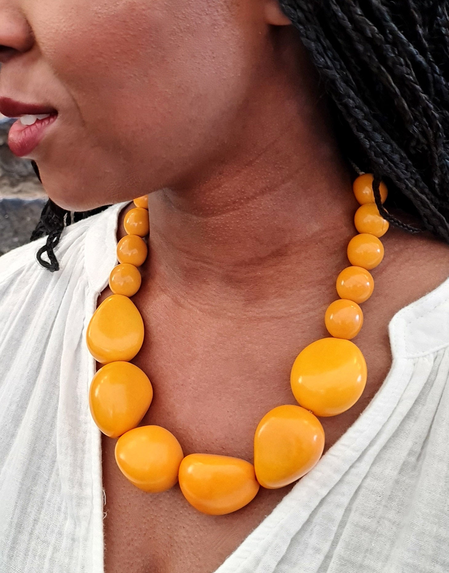 Organico Tagua Necklace featuring vibrant colors and handmade macrame clasp, showcasing its unique organic design.