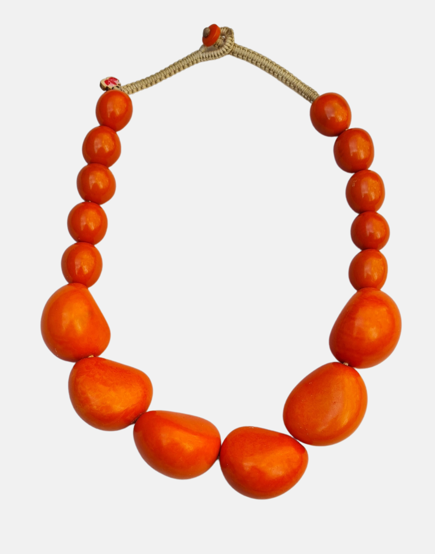 Organico Tagua Necklace featuring vibrant colors and handmade macrame clasp, showcasing its unique organic design.