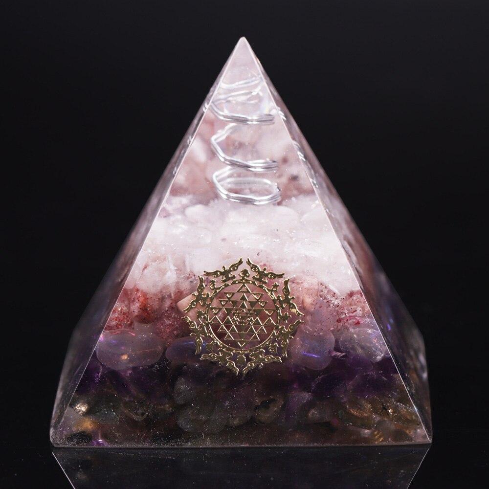 Orgone pyramid featuring clear white crystal point and strawberry crystal, handcrafted with natural stones for energy protection and decor.