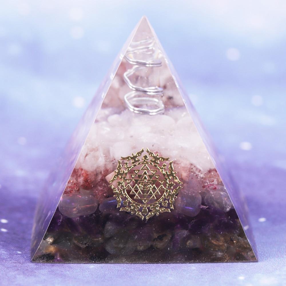 Orgone pyramid featuring clear white crystal point and strawberry crystal, handcrafted with natural stones for energy protection and decor.