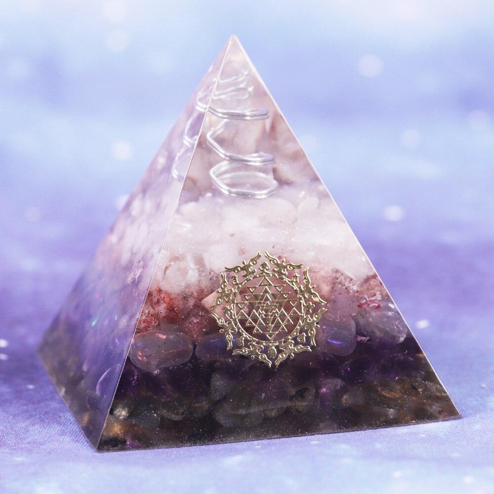 Orgone pyramid featuring clear white crystal point and strawberry crystal, handcrafted with natural stones for energy protection and decor.