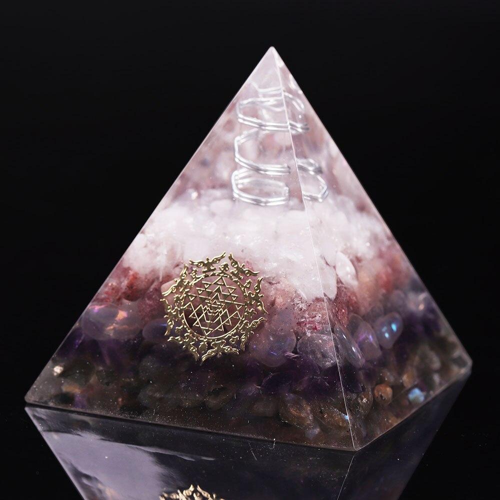 Orgone pyramid featuring clear white crystal point and strawberry crystal, handcrafted with natural stones for energy protection and decor.