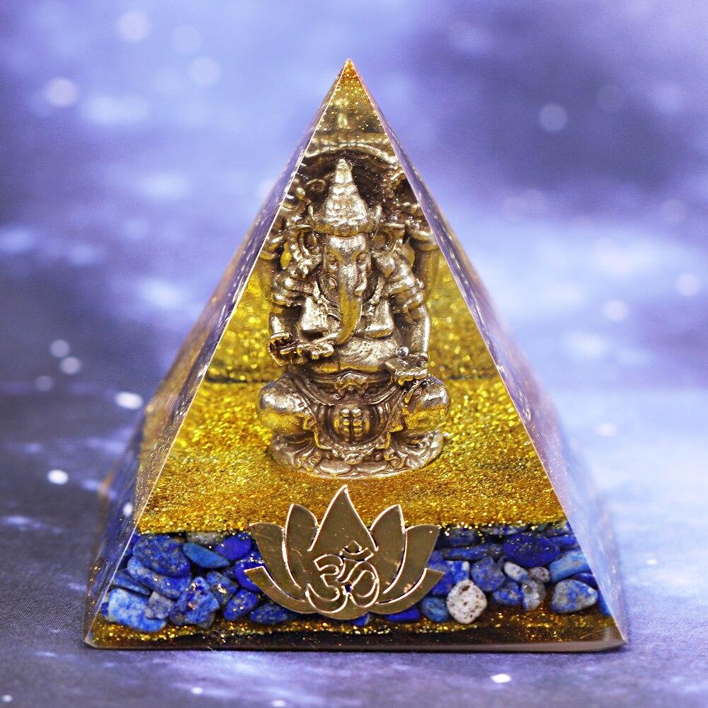 A handcrafted Orgone Pyramid featuring a Copper Ganesha design, made with natural Lapis Lazuli and resin, measuring 8cm in all dimensions.