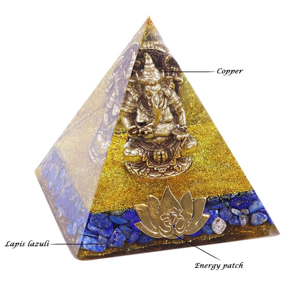 A handcrafted Orgone Pyramid featuring a Copper Ganesha design, made with natural Lapis Lazuli and resin, measuring 8cm in all dimensions.