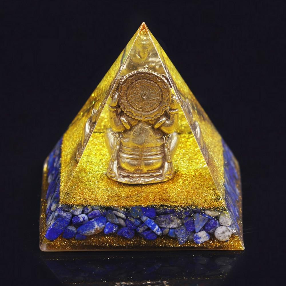 A handcrafted Orgone Pyramid featuring a Copper Ganesha design, made with natural Lapis Lazuli and resin, measuring 8cm in all dimensions.