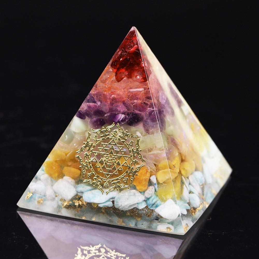 A beautifully crafted Orgonite Pyramid made from natural crystals including red agate, amethyst, and gold foil, featuring Metatron's Cube design.