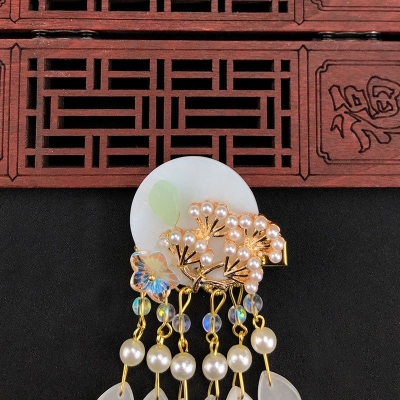 Elegant Oriental Shell Pearl Flower Hair Clip with tassels, showcasing intricate design and high-quality materials.