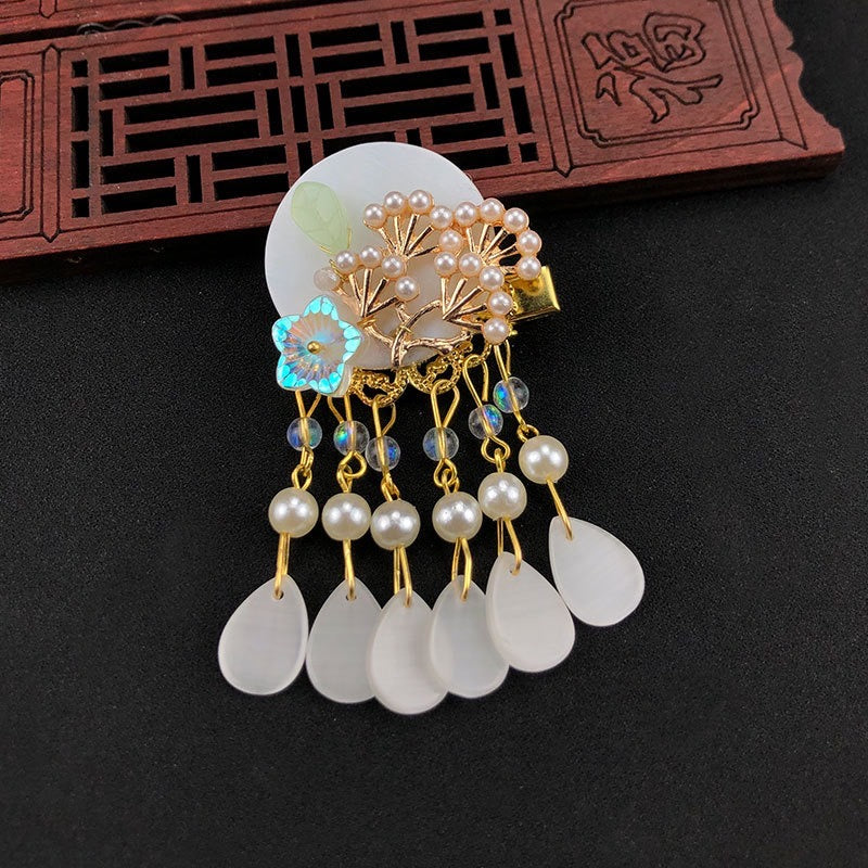 Elegant Oriental Shell Pearl Flower Hair Clip with tassels, showcasing intricate design and high-quality materials.