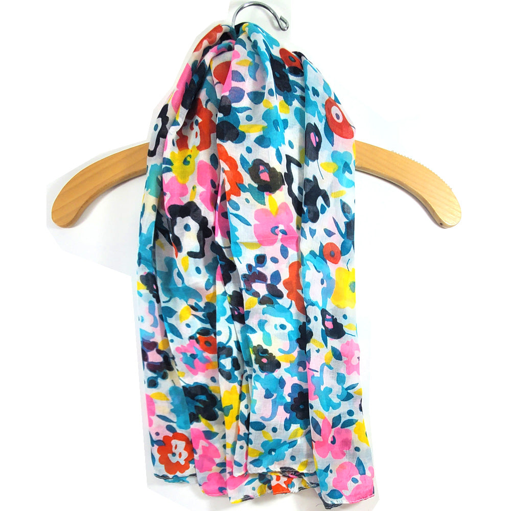 A vibrant multicolor scarf featuring origami flower designs, showcasing a stylish retro aesthetic, made from soft cotton and viscose.