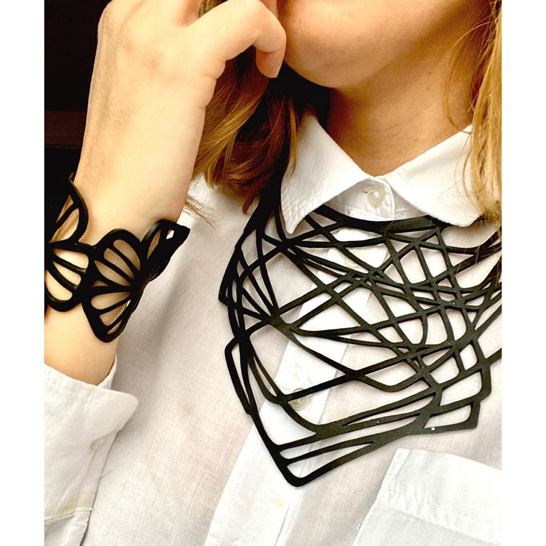 Orion Rubber Necklace made from upcycled inner tubes, featuring a geometric design and lightweight construction, displayed in a luxury gift box.