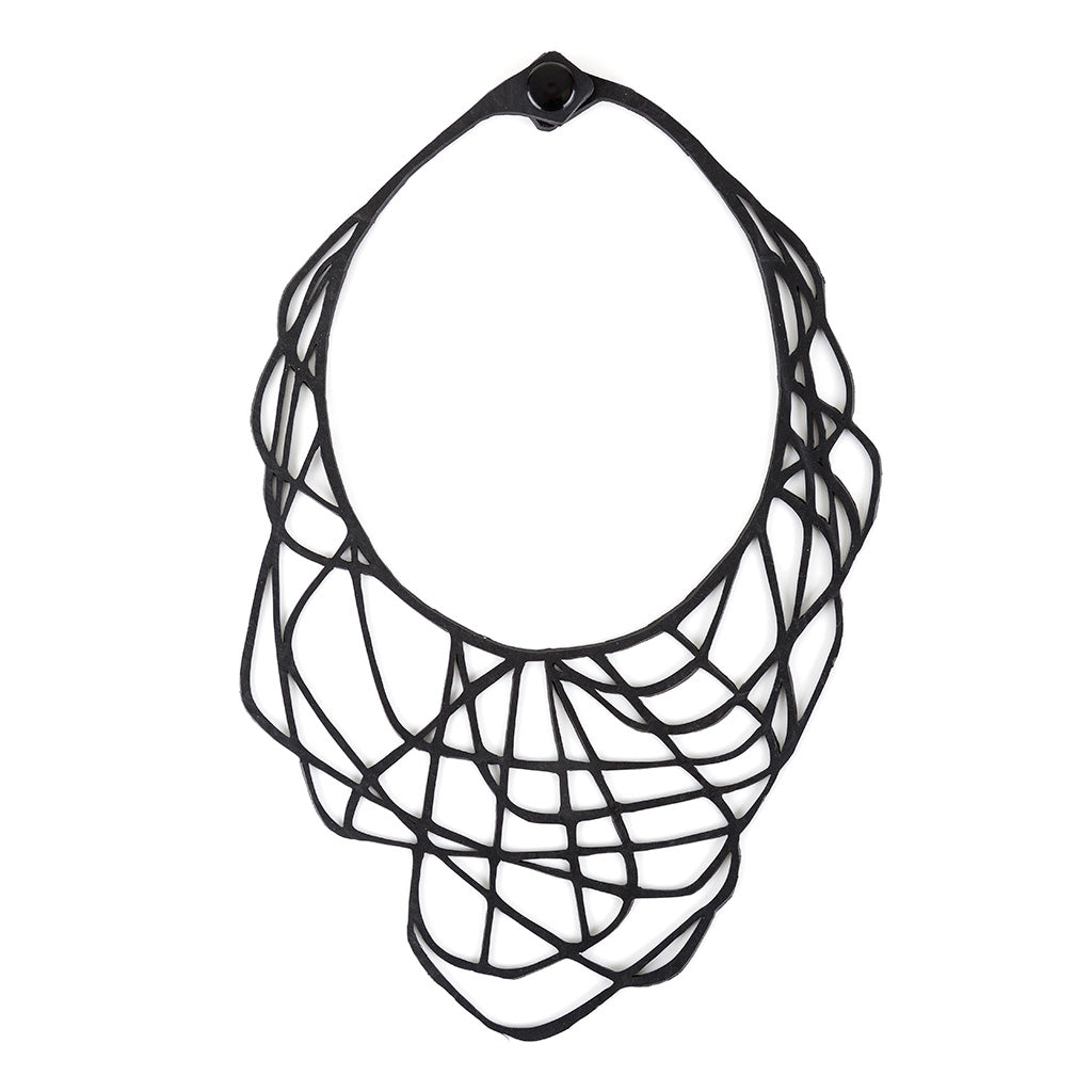 Orion Rubber Necklace made from upcycled inner tubes, featuring a geometric design and lightweight construction, displayed in a luxury gift box.