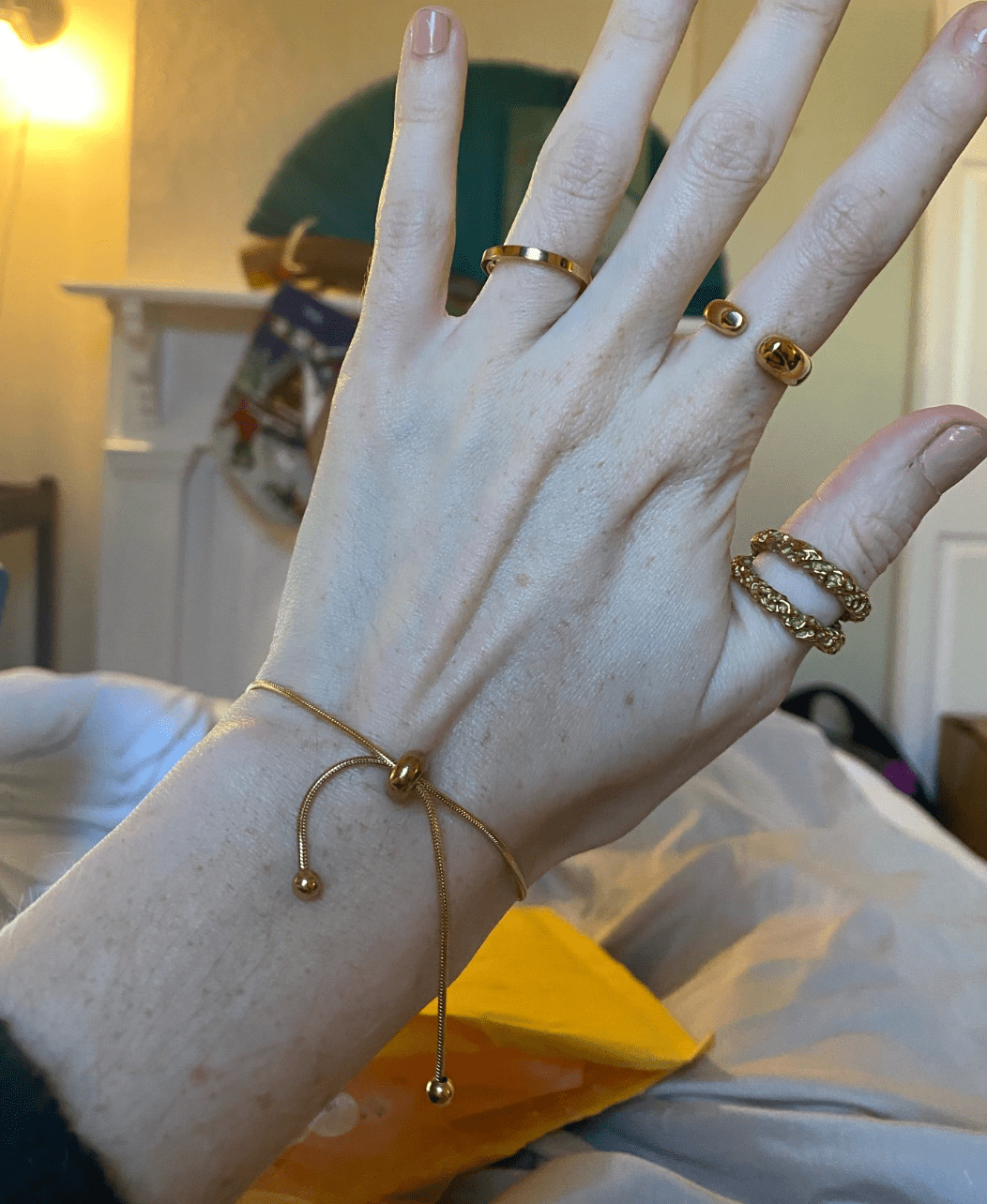 Orpheus Thin Gold Bracelet featuring a dainty snake chain design, adjustable length, and rich gold plating on stainless steel.