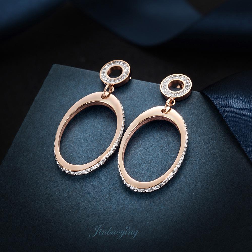 Elegant oval dangle earrings made of stainless steel with gold plating, showcasing a stylish design suitable for everyday wear.