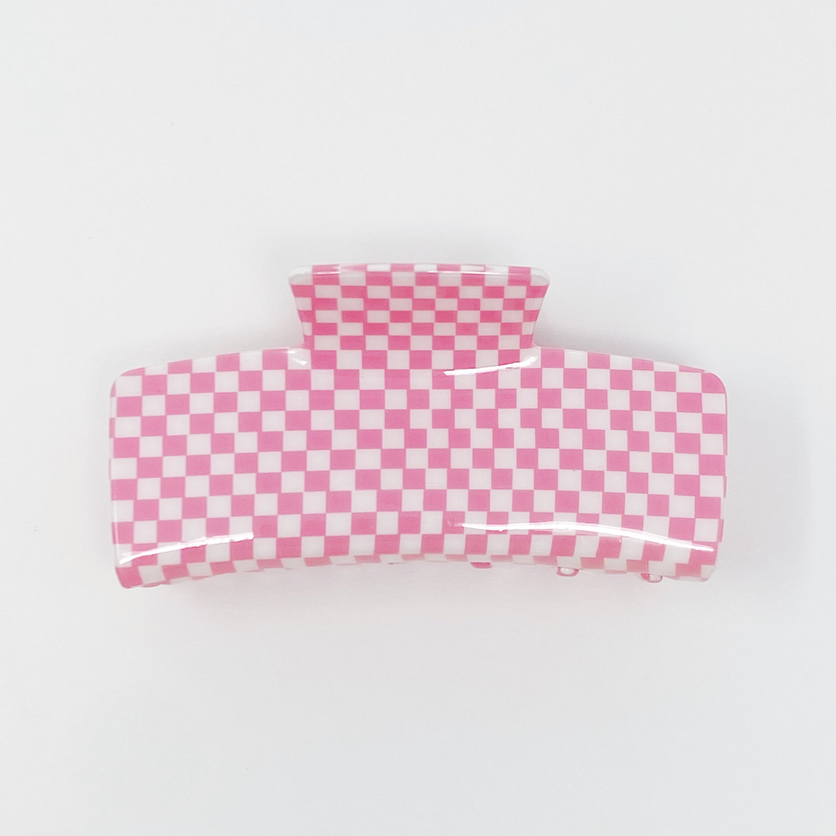 Oversized checkered hair claw clip in black and white pattern, designed for thick hair, measuring 4 inches by 2 inches.