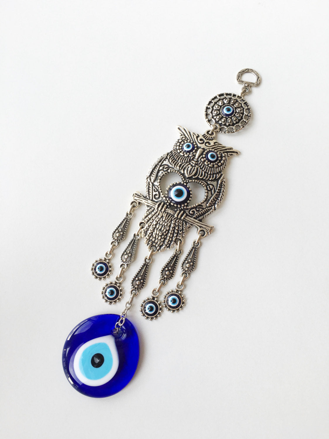 Handmade Owl Evil Eye Wall Hanging featuring a vibrant evil eye bead and an intricately designed owl figure, symbolizing protection and good luck.