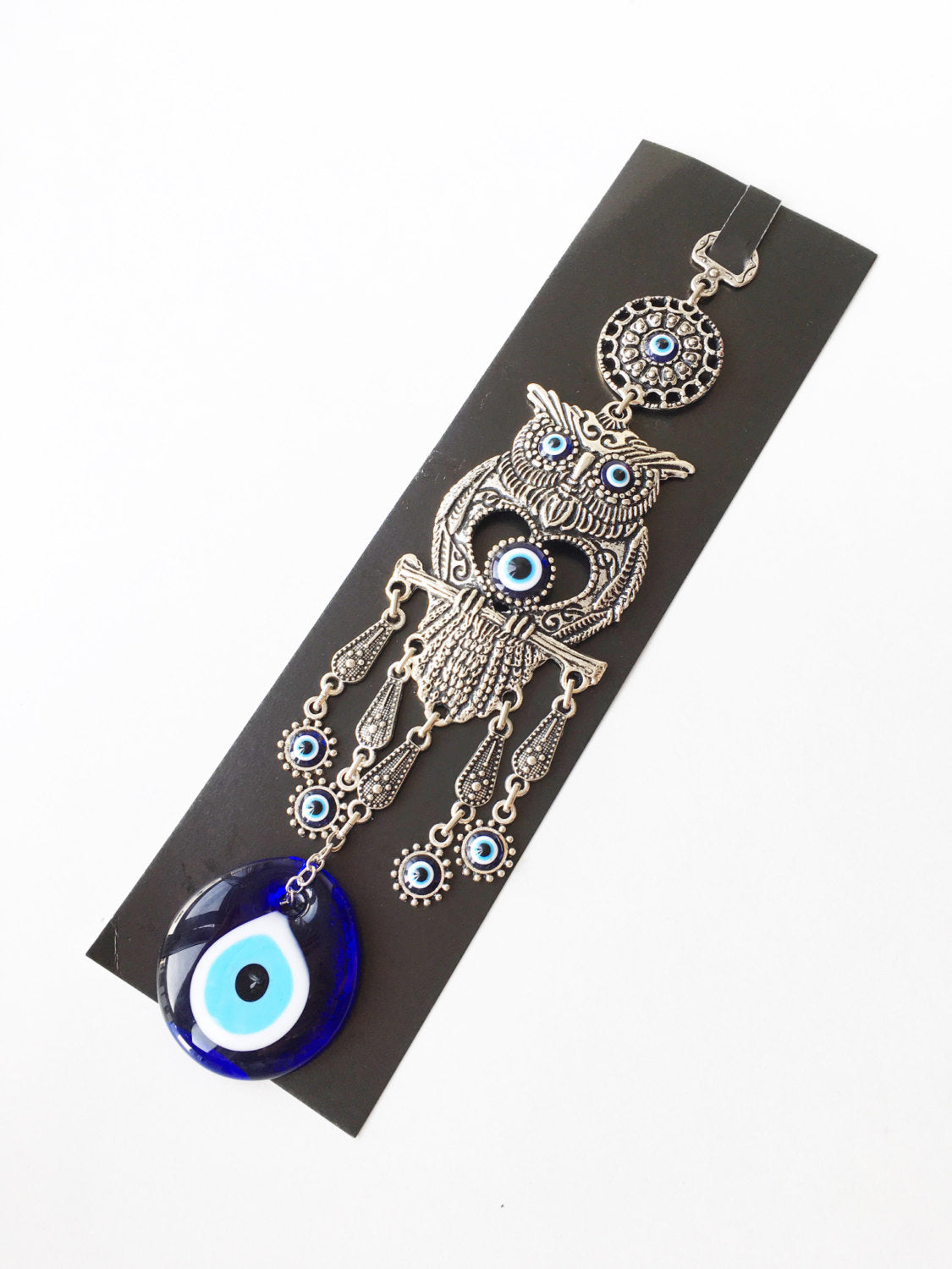 Handmade Owl Evil Eye Wall Hanging featuring a vibrant evil eye bead and an intricately designed owl figure, symbolizing protection and good luck.