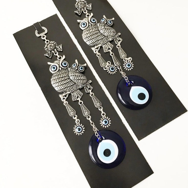 Handmade Owl Evil Eye Wall Hanging featuring a blue evil eye charm and intricate metal design, perfect for home decor.