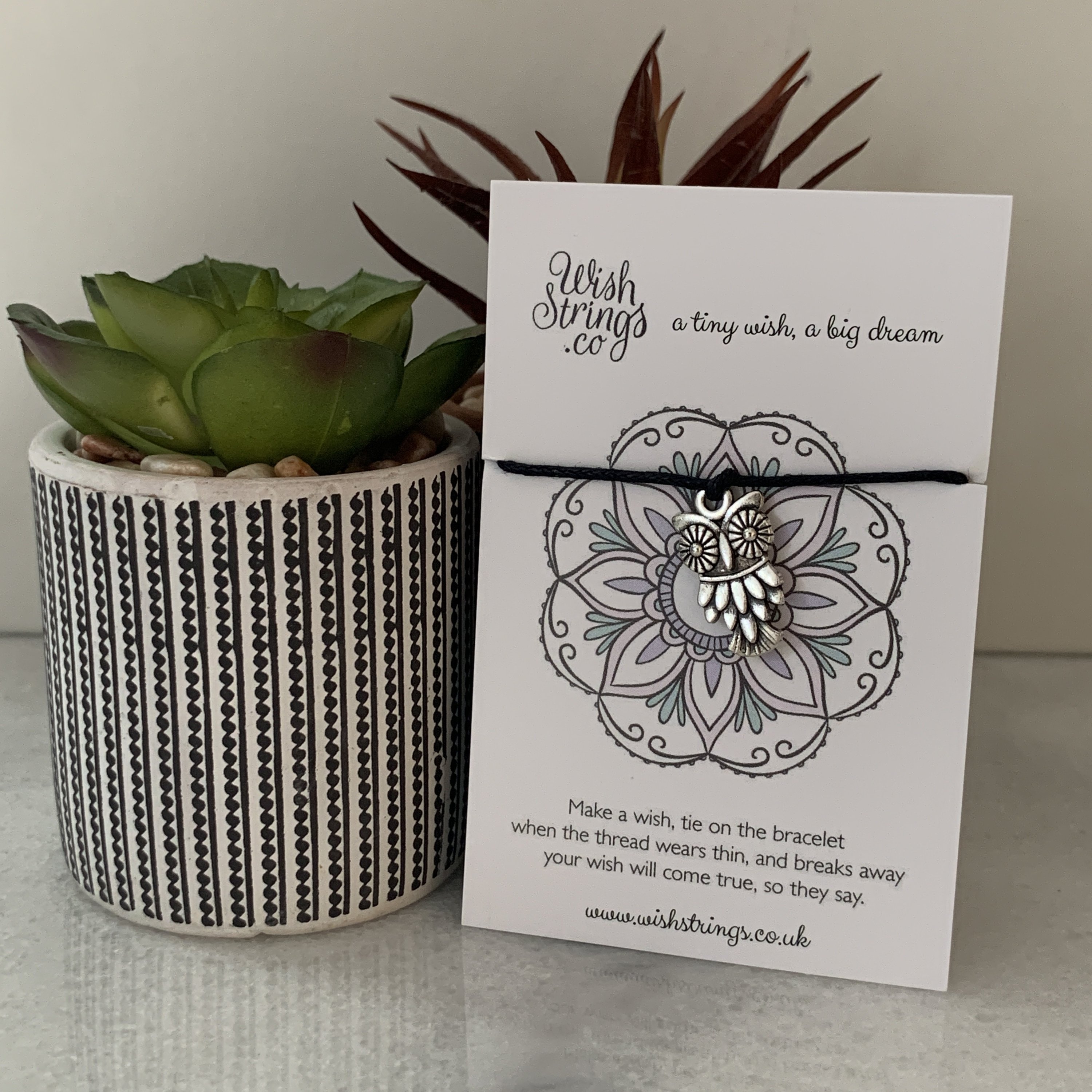 OWL WishStrings Wish Bracelet featuring a Tibetan Silver charm on a waxed cotton cord, beautifully presented on an inspirational display card.