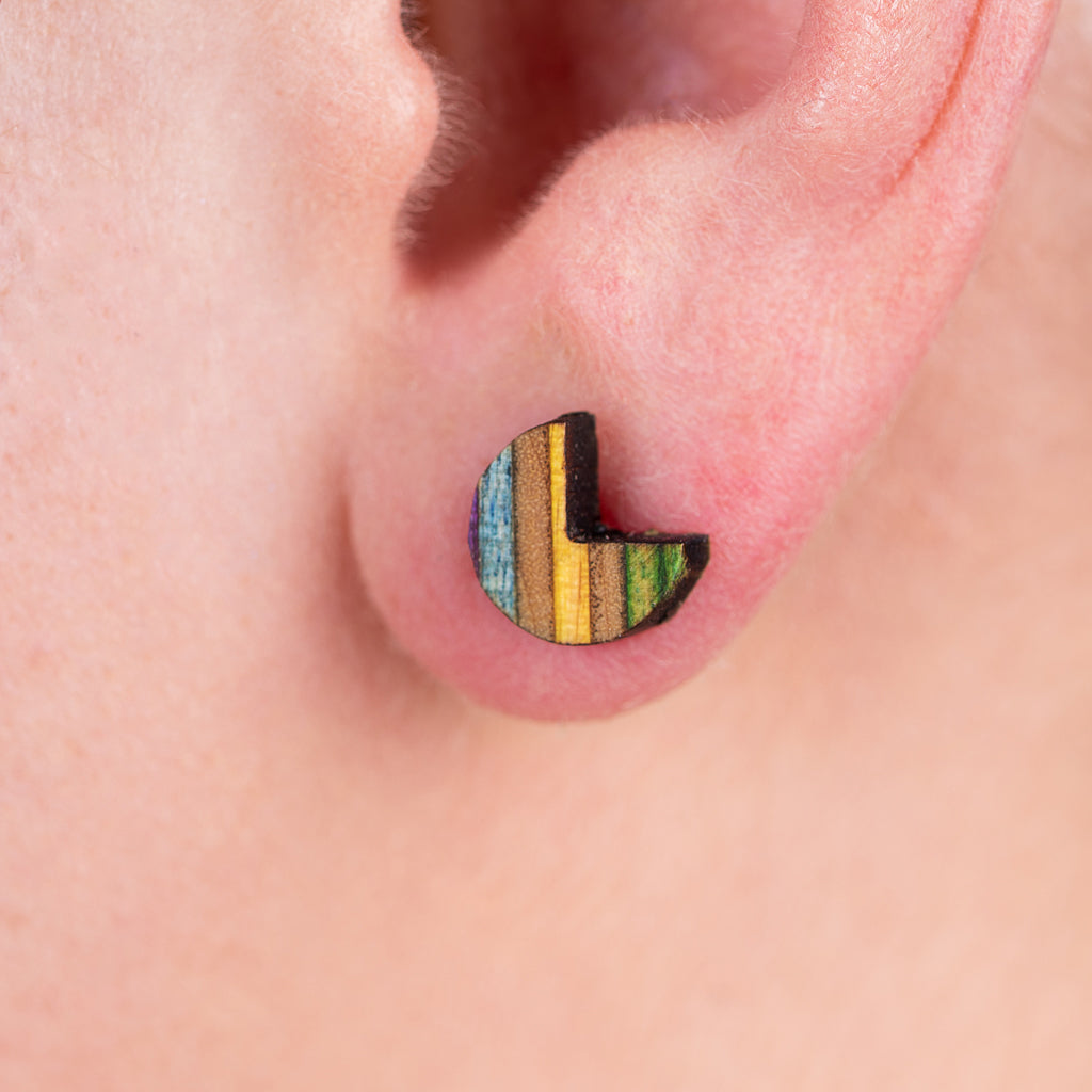 Colorful Pac Recycled Skateboard Stud Earrings made from upcycled skateboard materials, showcasing unique patterns and vibrant layers.