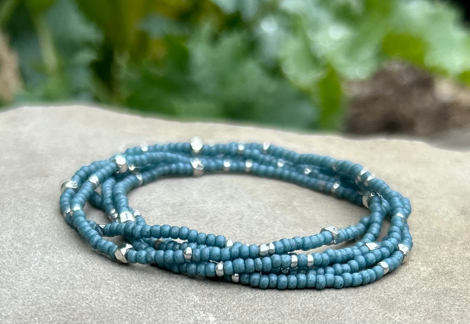 Pale blue and silver-sprinkled beaded boho wrap bracelet, showcasing high-quality MIYUKI glass seed beads with a layered design.