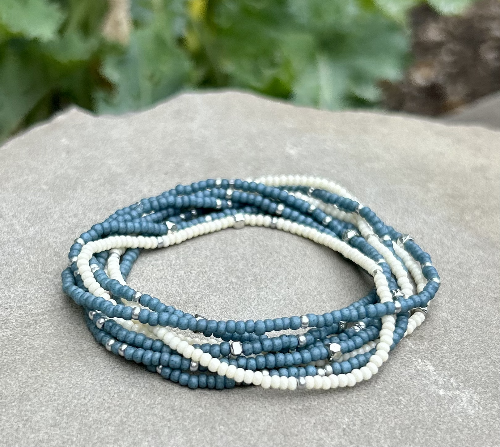 Pale blue and silver-sprinkled beaded boho wrap bracelet, showcasing high-quality MIYUKI glass seed beads with a layered design.