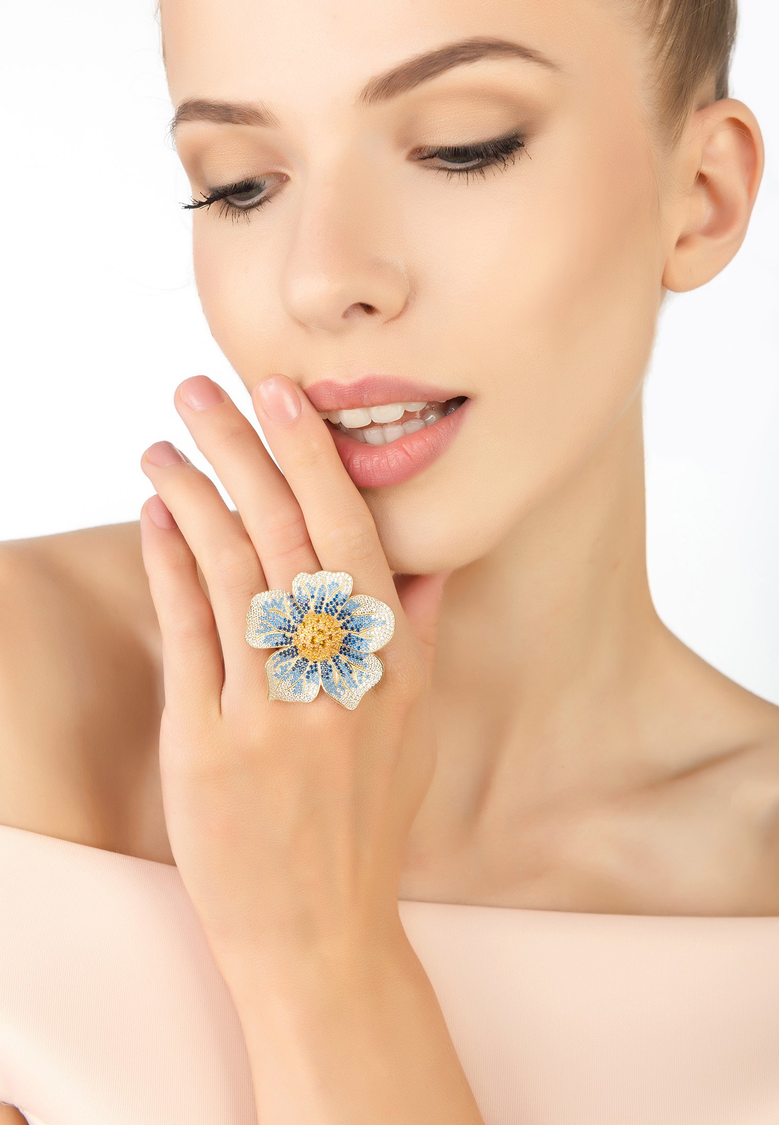 A beautiful Pansy Flower Blue Ring Gold featuring cubic zirconia petals in shades of blue and white, with a vibrant yellow center, set in 22ct gold.