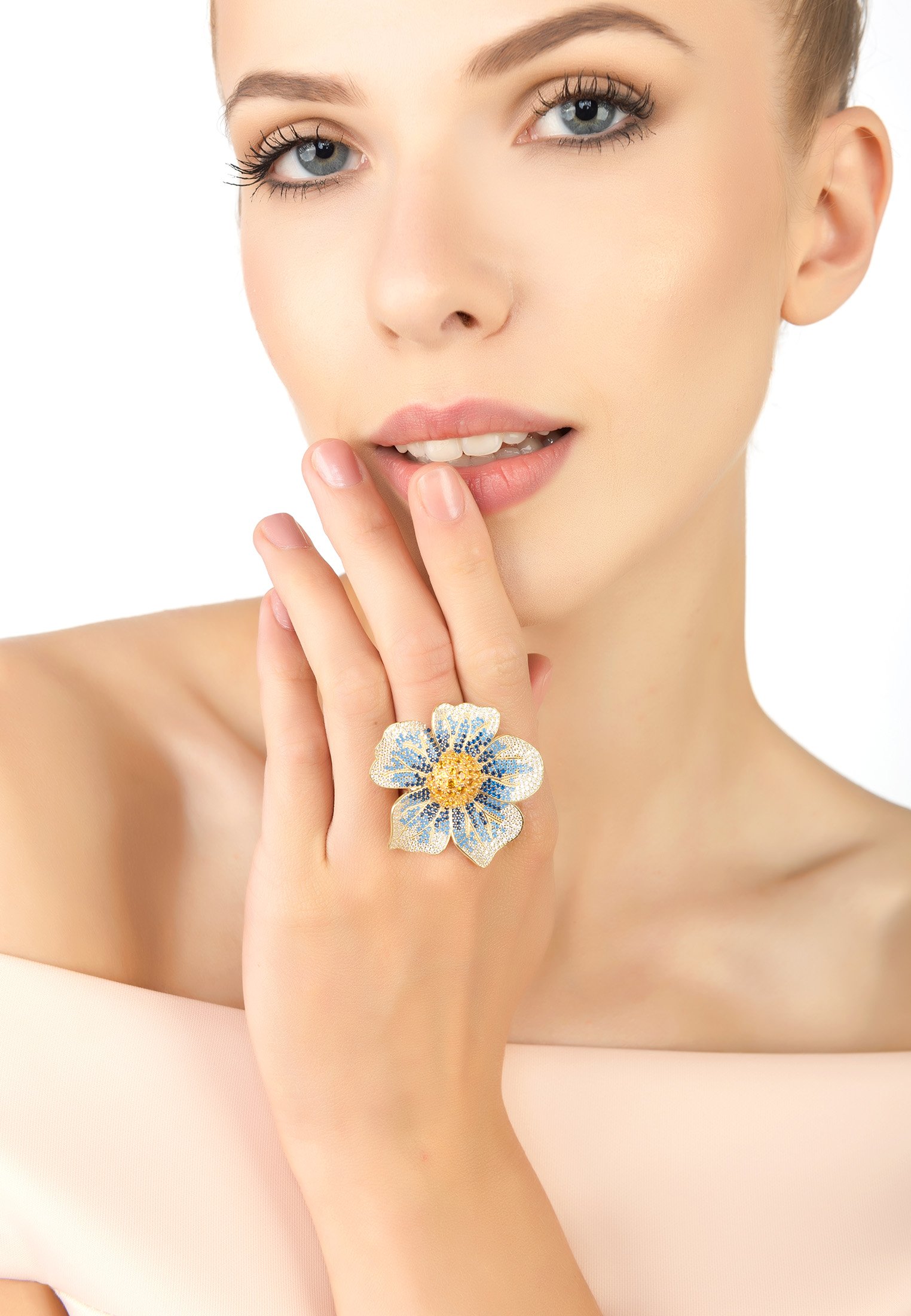 A beautiful Pansy Flower Blue Ring Gold featuring cubic zirconia petals in shades of blue and white, with a vibrant yellow center, set in 22ct gold.