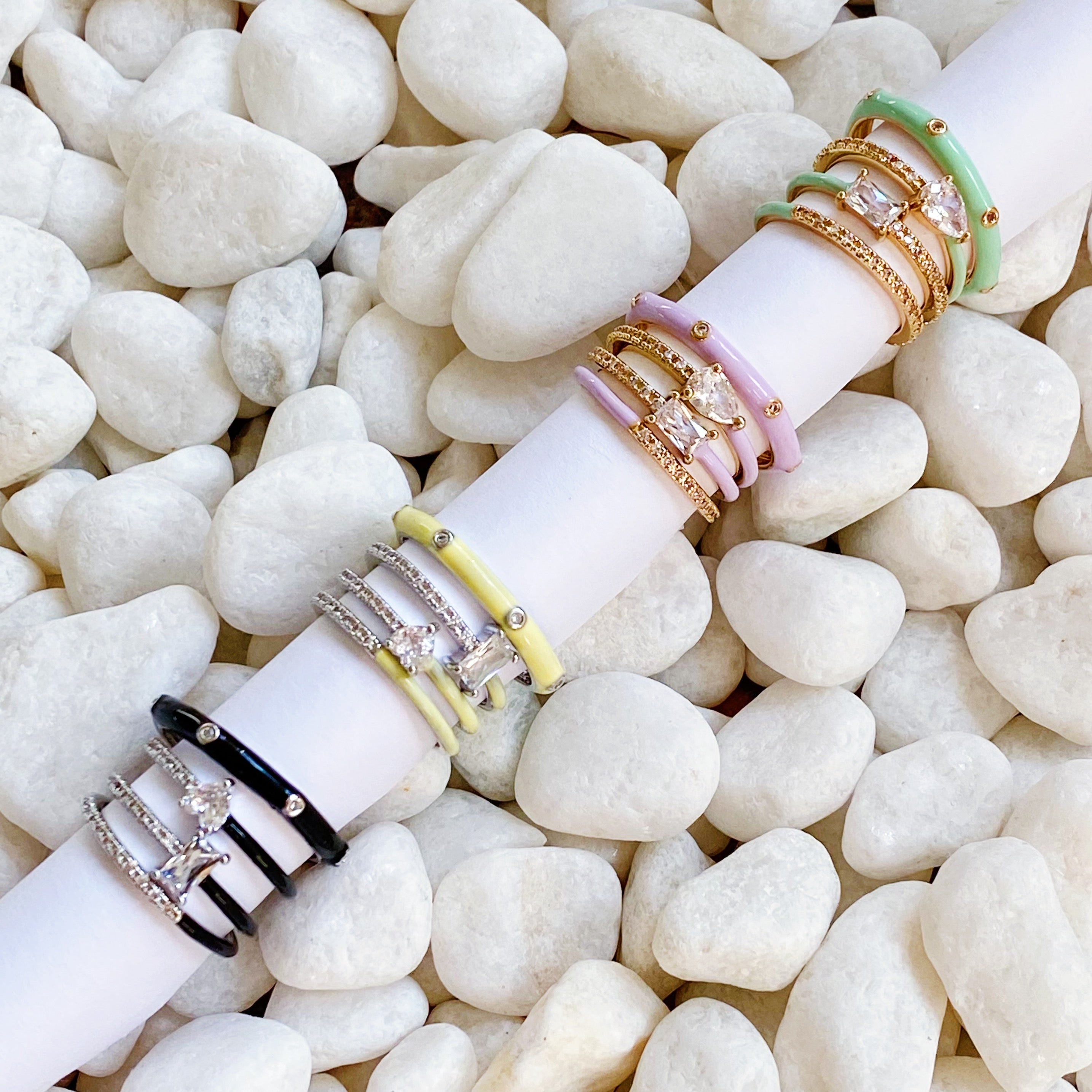 Pastel Glam Ring Set of 4 featuring colorful enamel and rhinestone details, showcasing three size 5 rings and one size 7 ring.