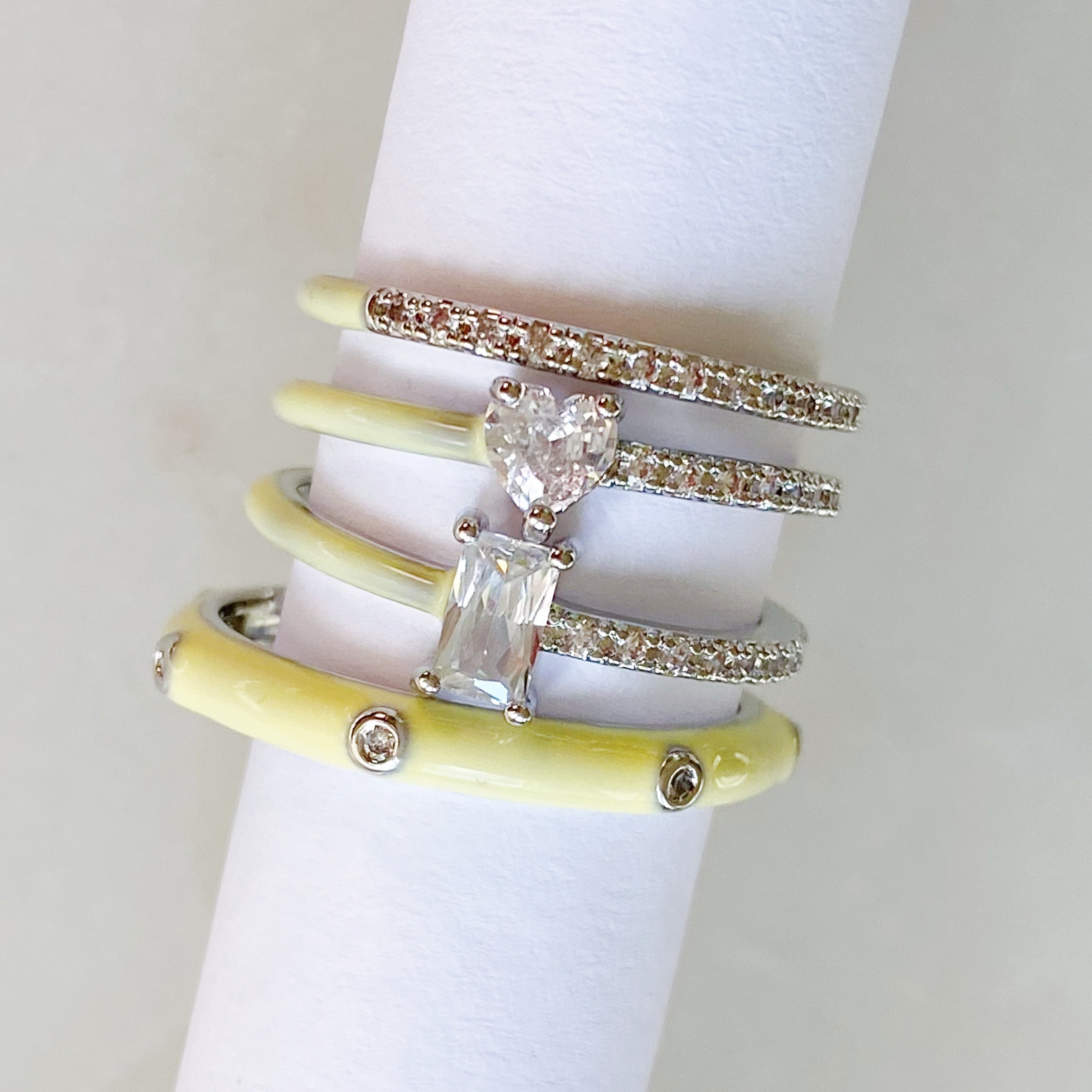 Pastel Glam Ring Set of 4 featuring colorful enamel and rhinestone details, showcasing three size 5 rings and one size 7 ring.