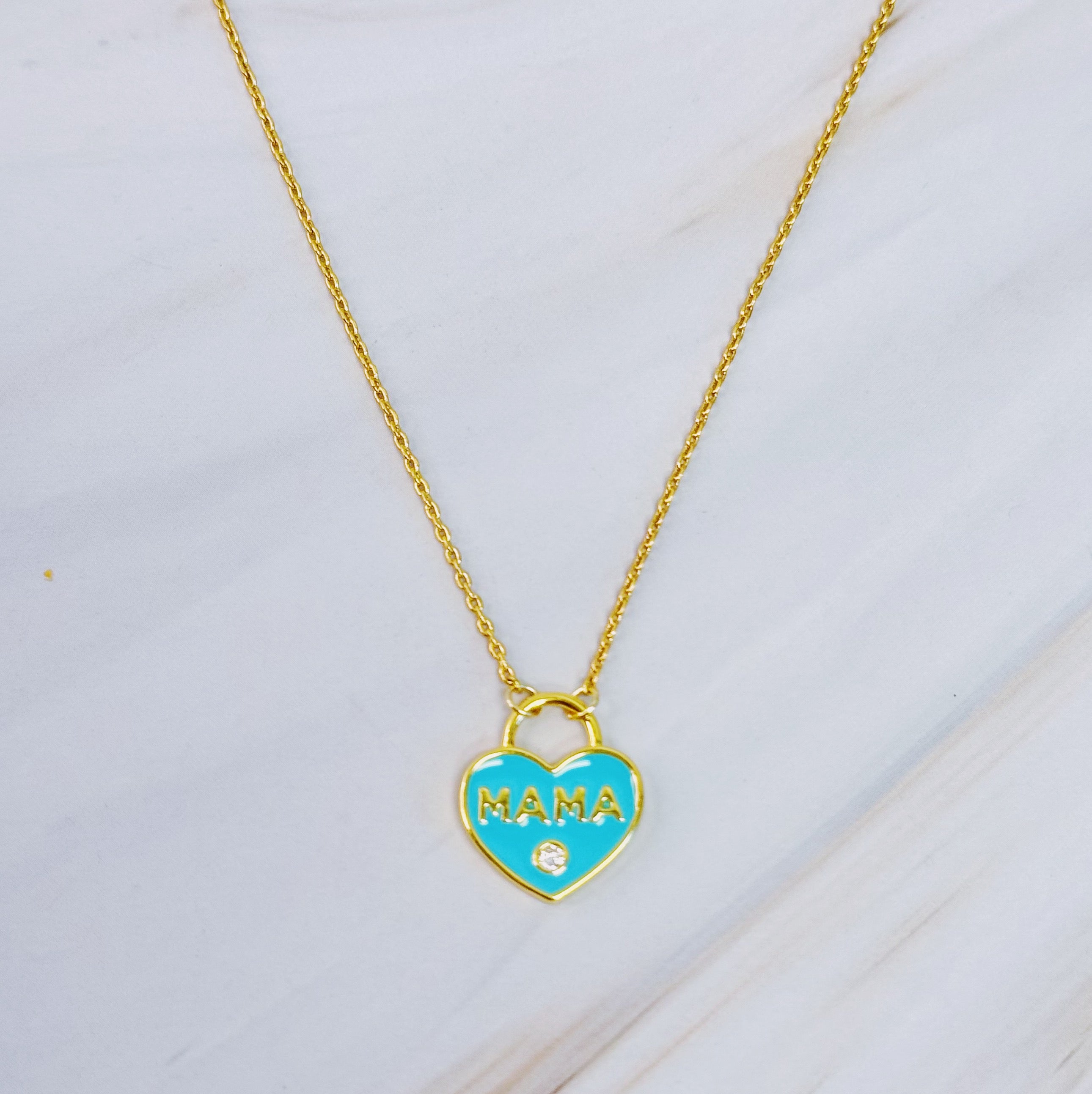 Pastel locket Mama necklace with gold plated brass chain and intricate pendant design, perfect for mothers.