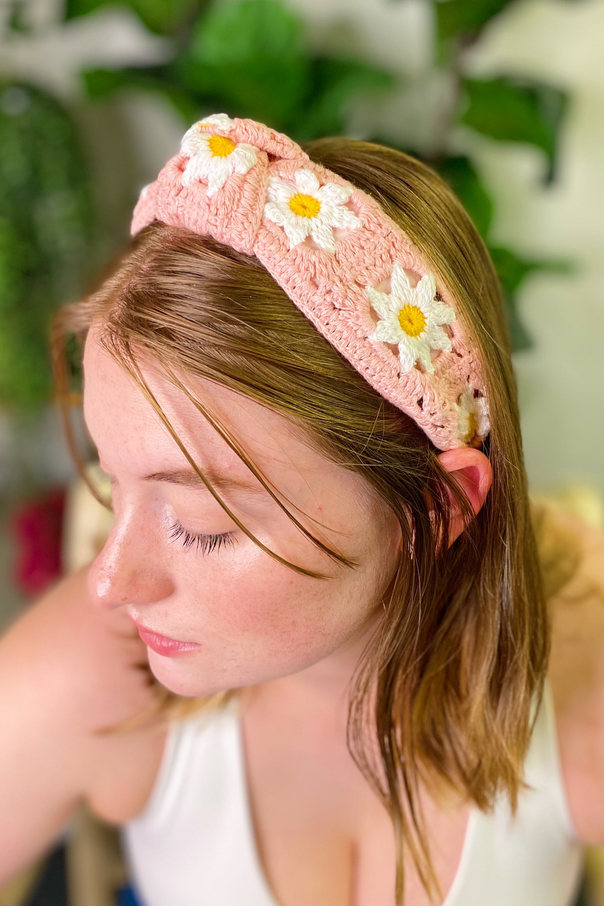 A colorful patchwork crochet headband with soft edges, perfect for everyday wear.