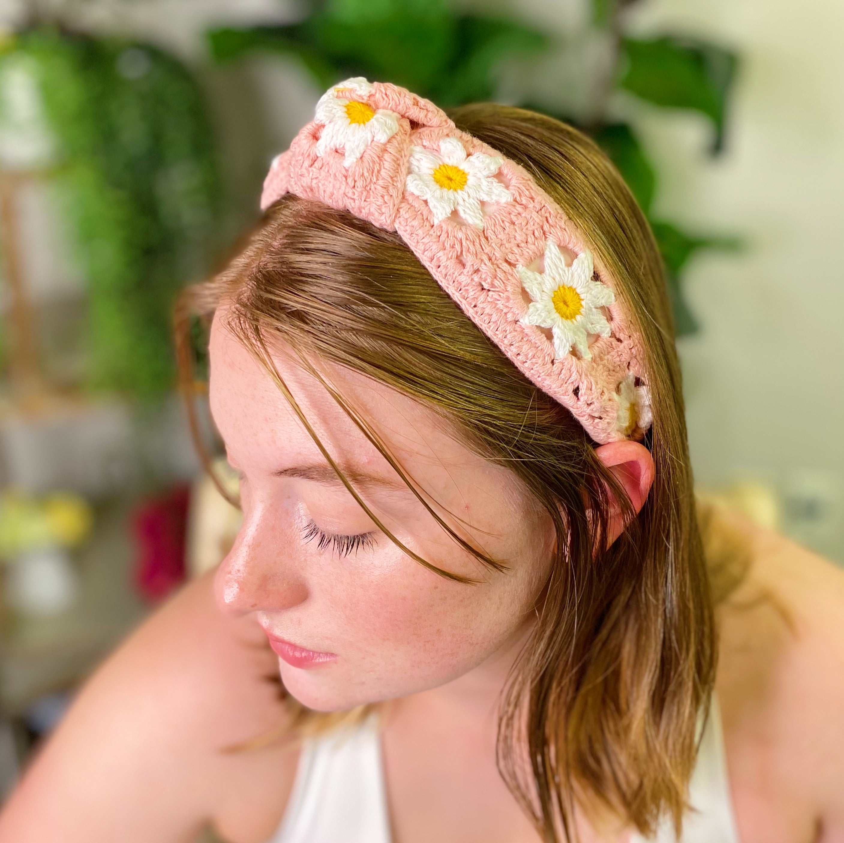 A colorful patchwork crochet headband with soft edges, perfect for everyday wear.