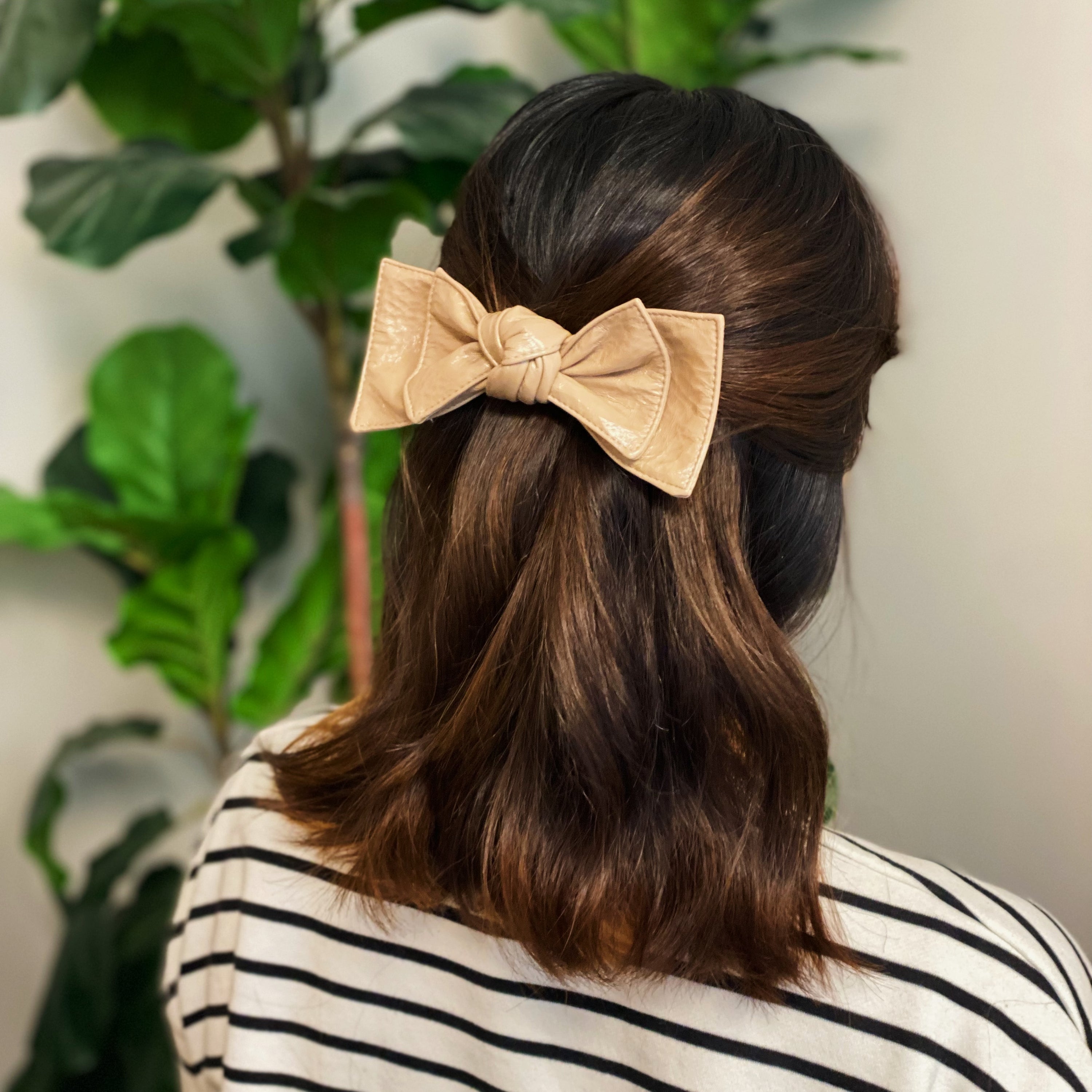 Patent Double Bow Hair Clip in faux patent leather, featuring a stylish double bow design, perfect for various hairstyles.