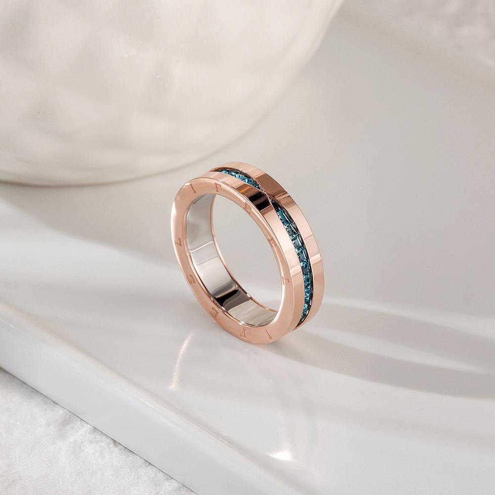 PAVÉ Statement Ring featuring blue CZ stones in a rose gold setting, elegantly displayed in a gift box.