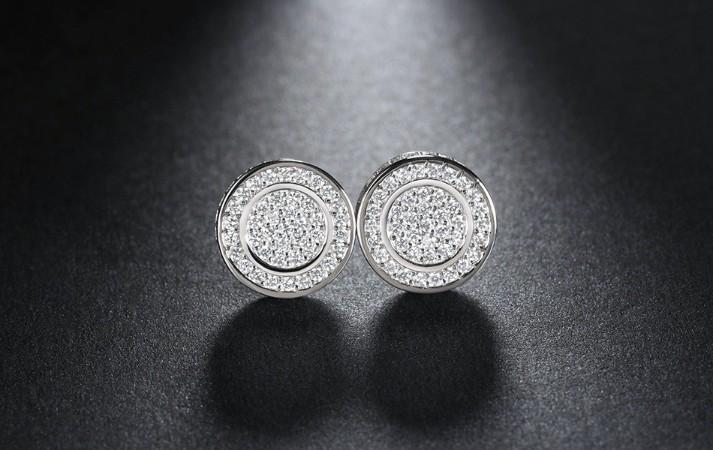 Elegant Pave Disc Stud Earrings embellished with certified crystals, crafted in 18K white gold plating, showcasing a luxurious and timeless design.