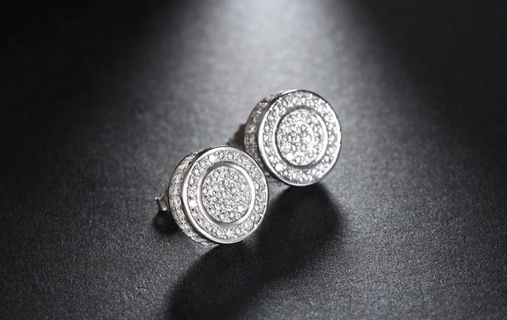 Elegant Pave Disc Stud Earrings embellished with certified crystals, crafted in 18K white gold plating, showcasing a luxurious and timeless design.