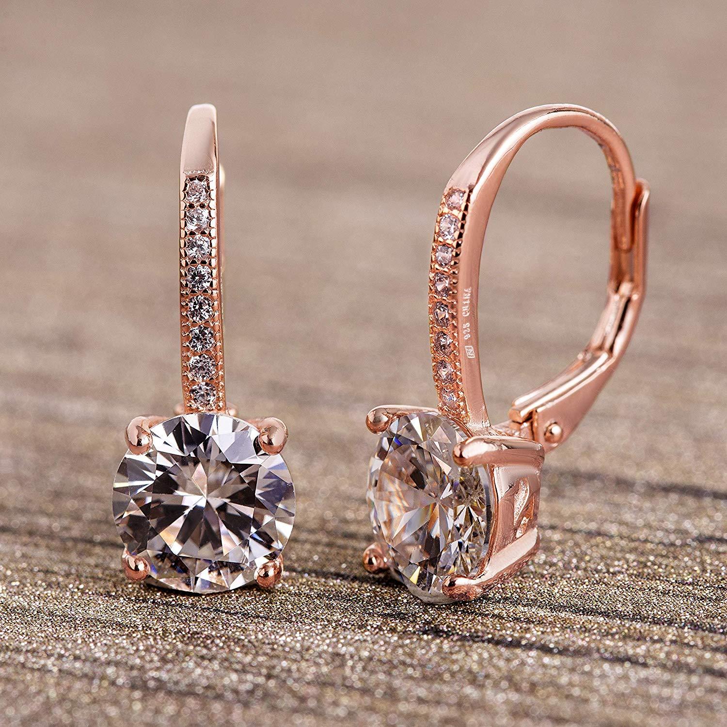 Elegant Pave Leverback Earrings in 18K Gold featuring sparkling Elements, available in white, yellow, and rose gold tones.